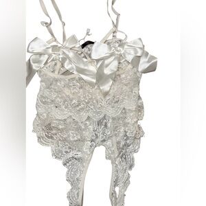 Chic White Lace Bodysuit with Satin Bows